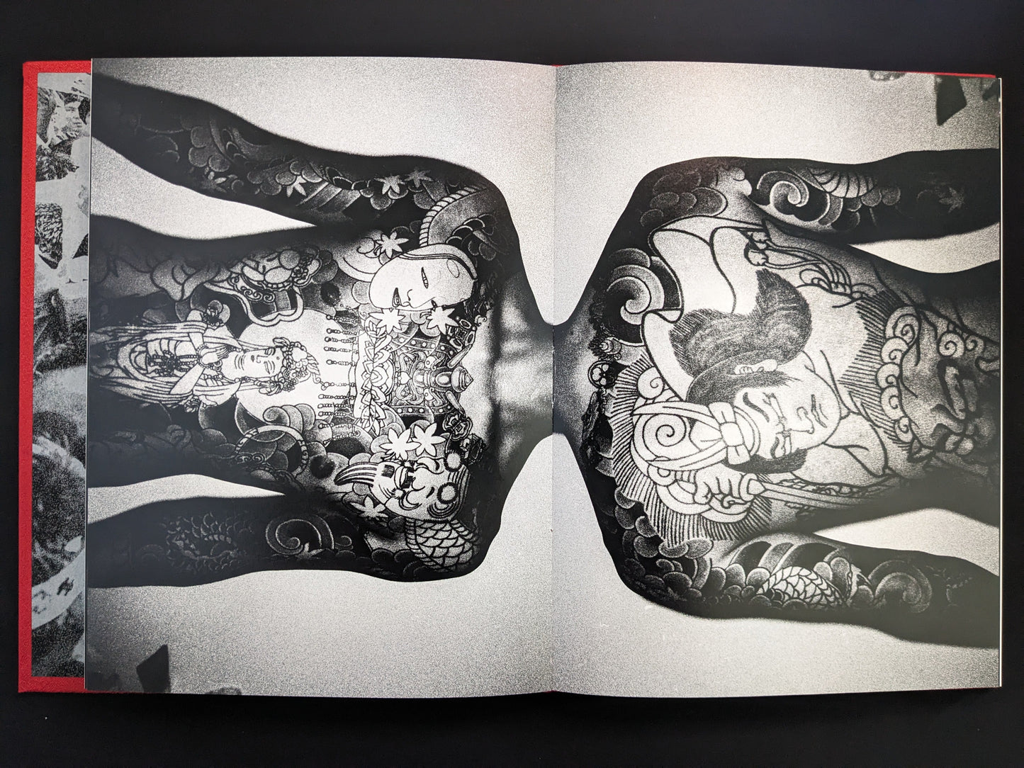 Close-up of a full-back Japanese tattoo featuring mythological figures.
