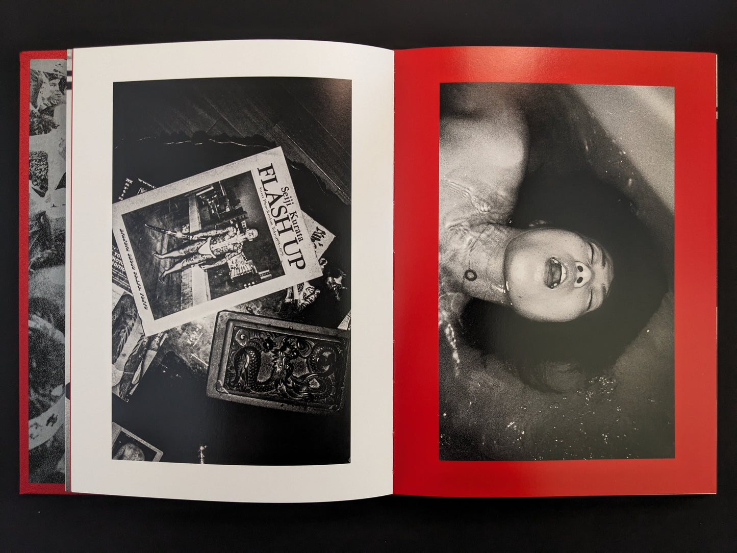 Still life with cards and a woman submerged in a bathtub.