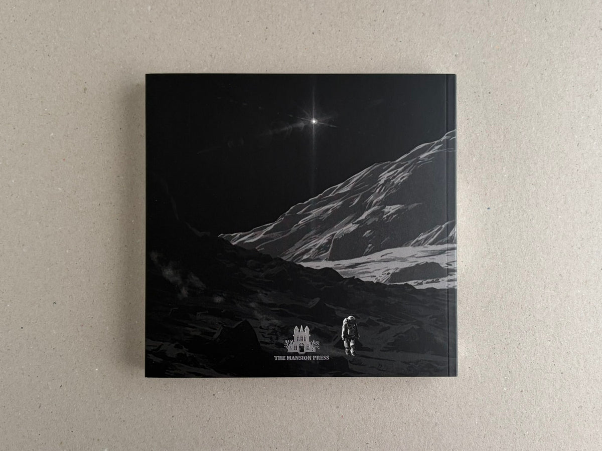 Back cover with an astronaut on a rocky slope and a starburst in the distance.