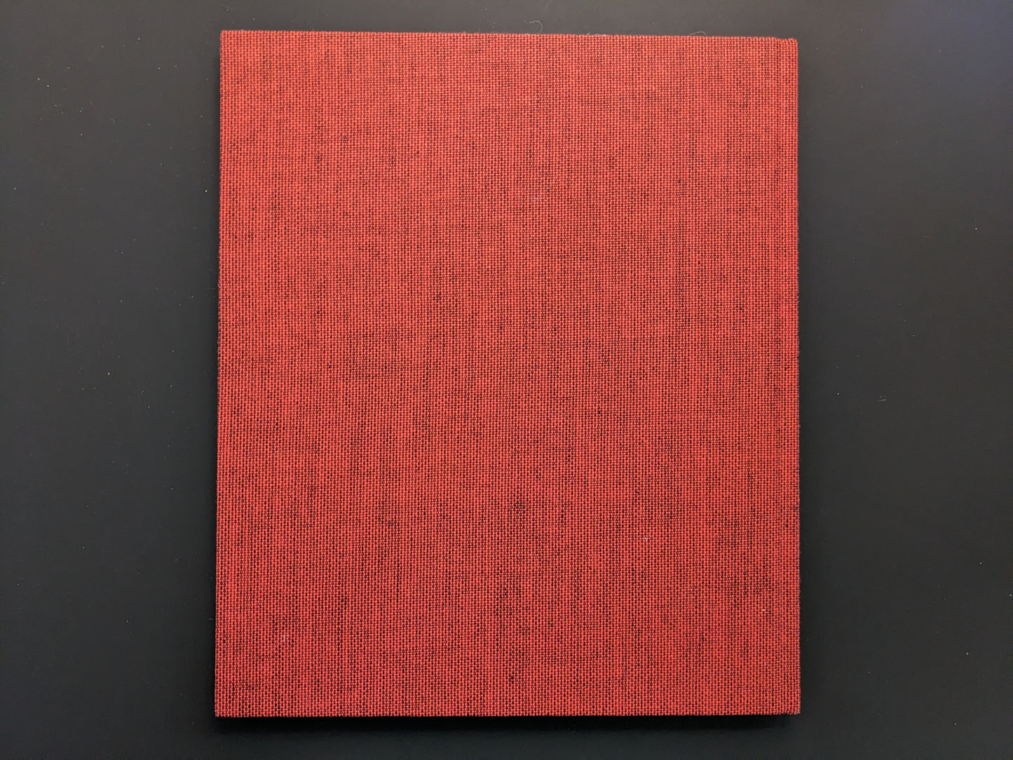 Back cover of Berg Werk photobook by Sincei Yamamoto with red cloth binding