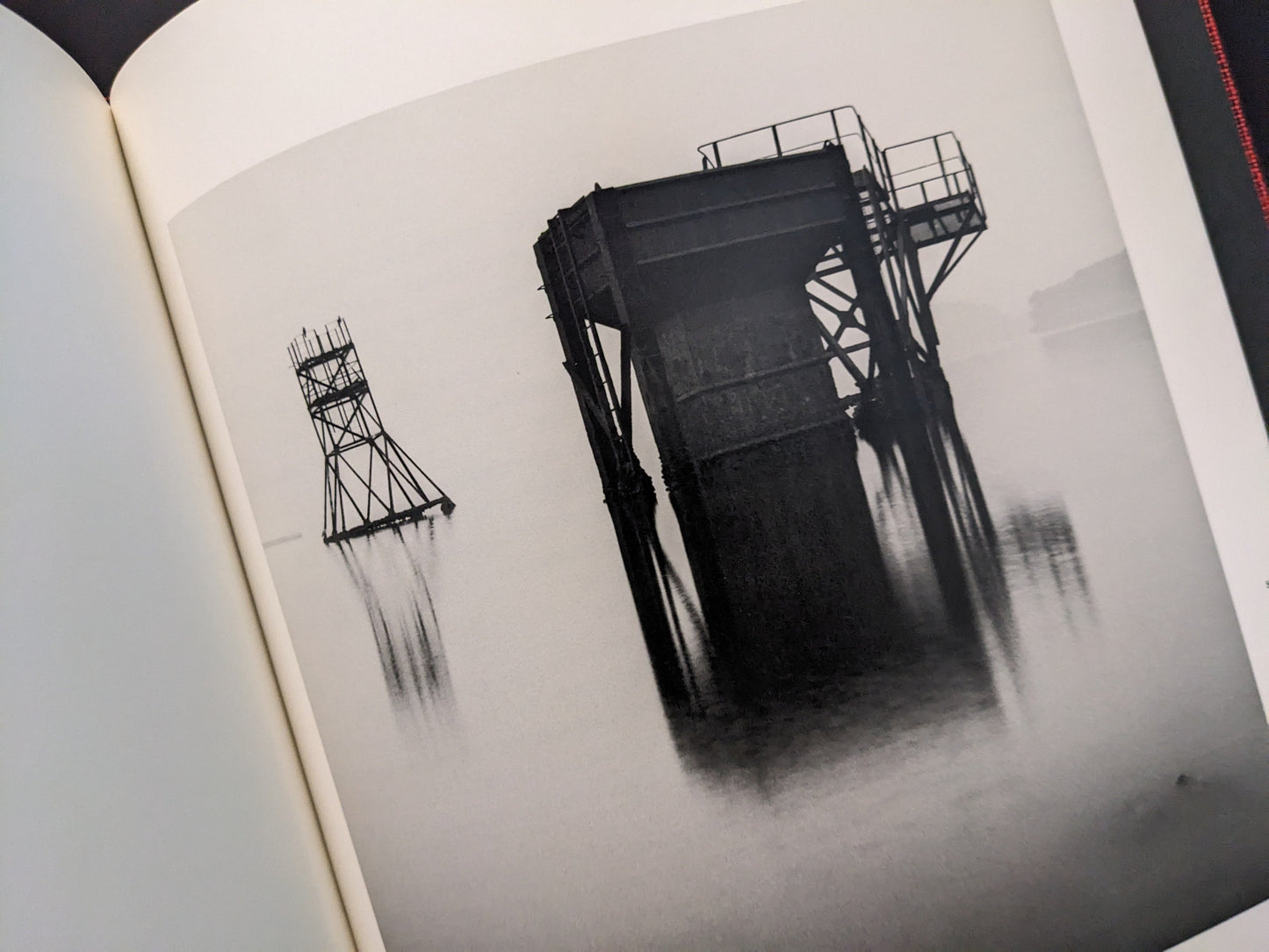 Abstract image of a collapsing coal tower reflected on water, from Berg Werk by Sincei Yamamoto