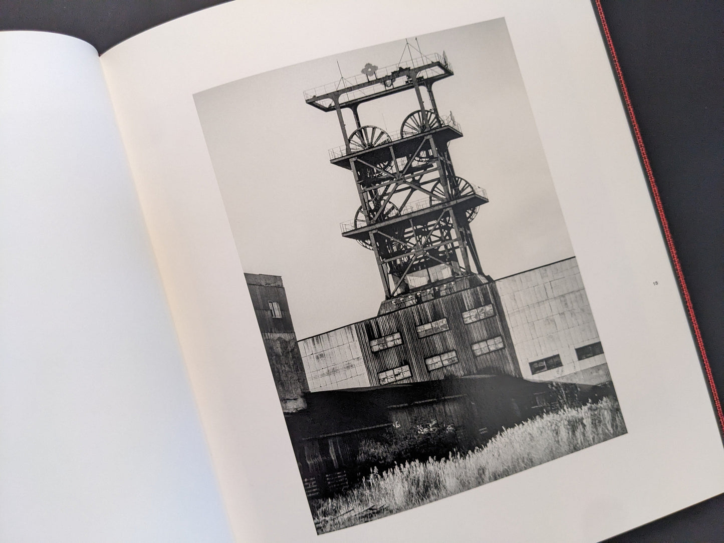 Black-and-white photograph of mining tower structure from Berg Werk by Sincei Yamamoto
