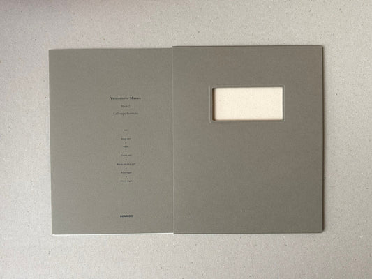 Birds 2 by Masao Yamamoto, grey portfolio case with a window cut-out and printed title on the cover.