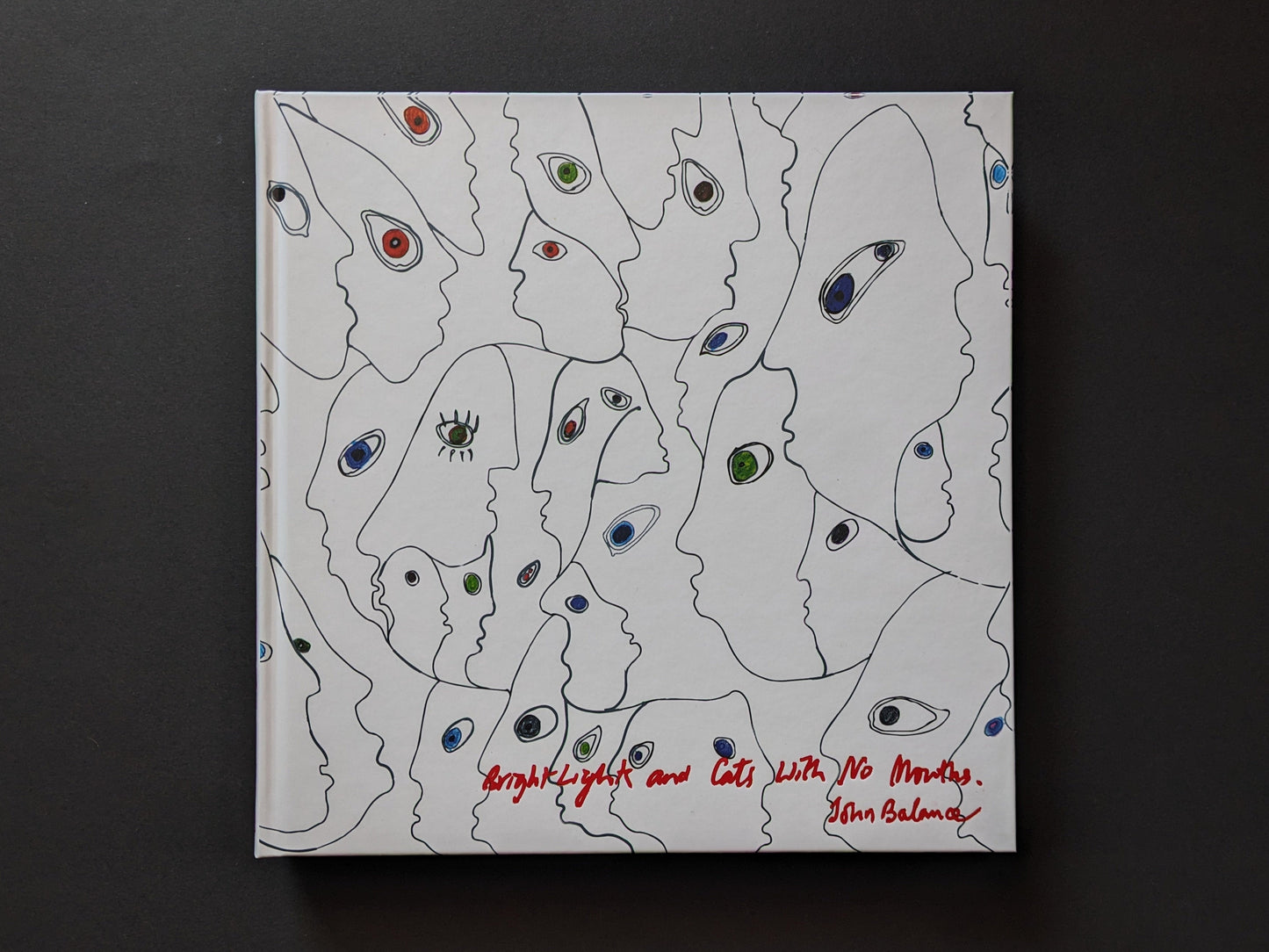 Cover of the book Bright Lights and Cats with No Mouths by John Balance, illustrated with abstract eye-filled faces.