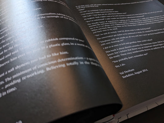 Close-up of a black page with white text in English, showing Val Denham’s reflective statement about John Balance.