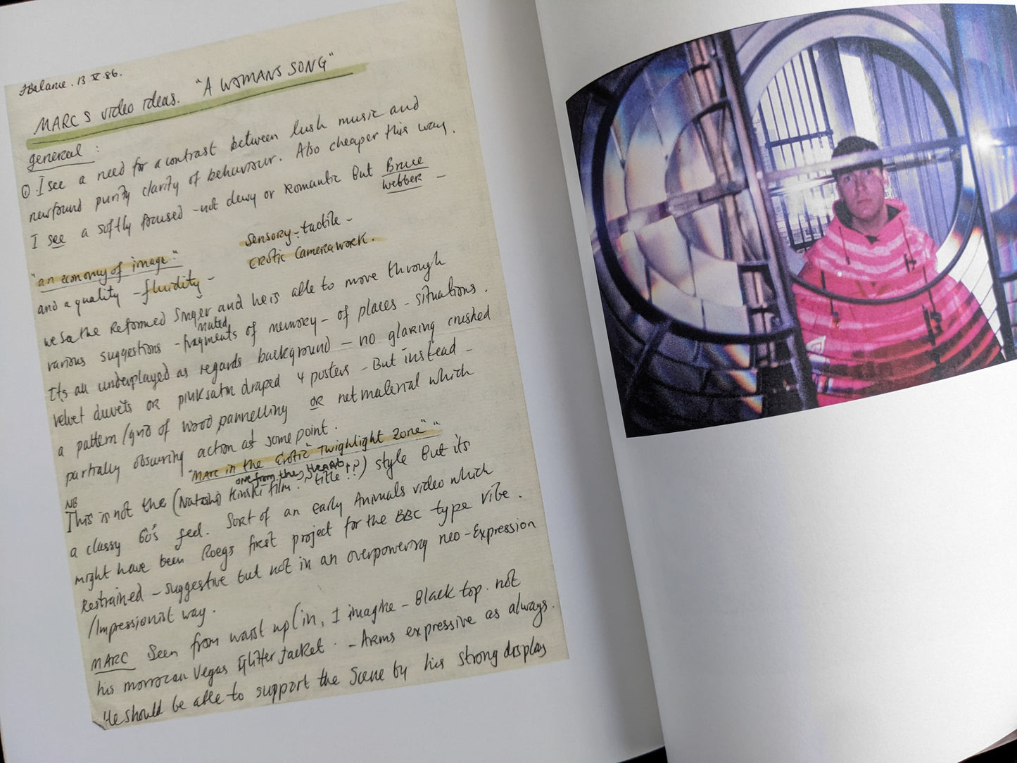 Page with handwritten video concept notes and a color photograph of John Balance inside a large optical lens.