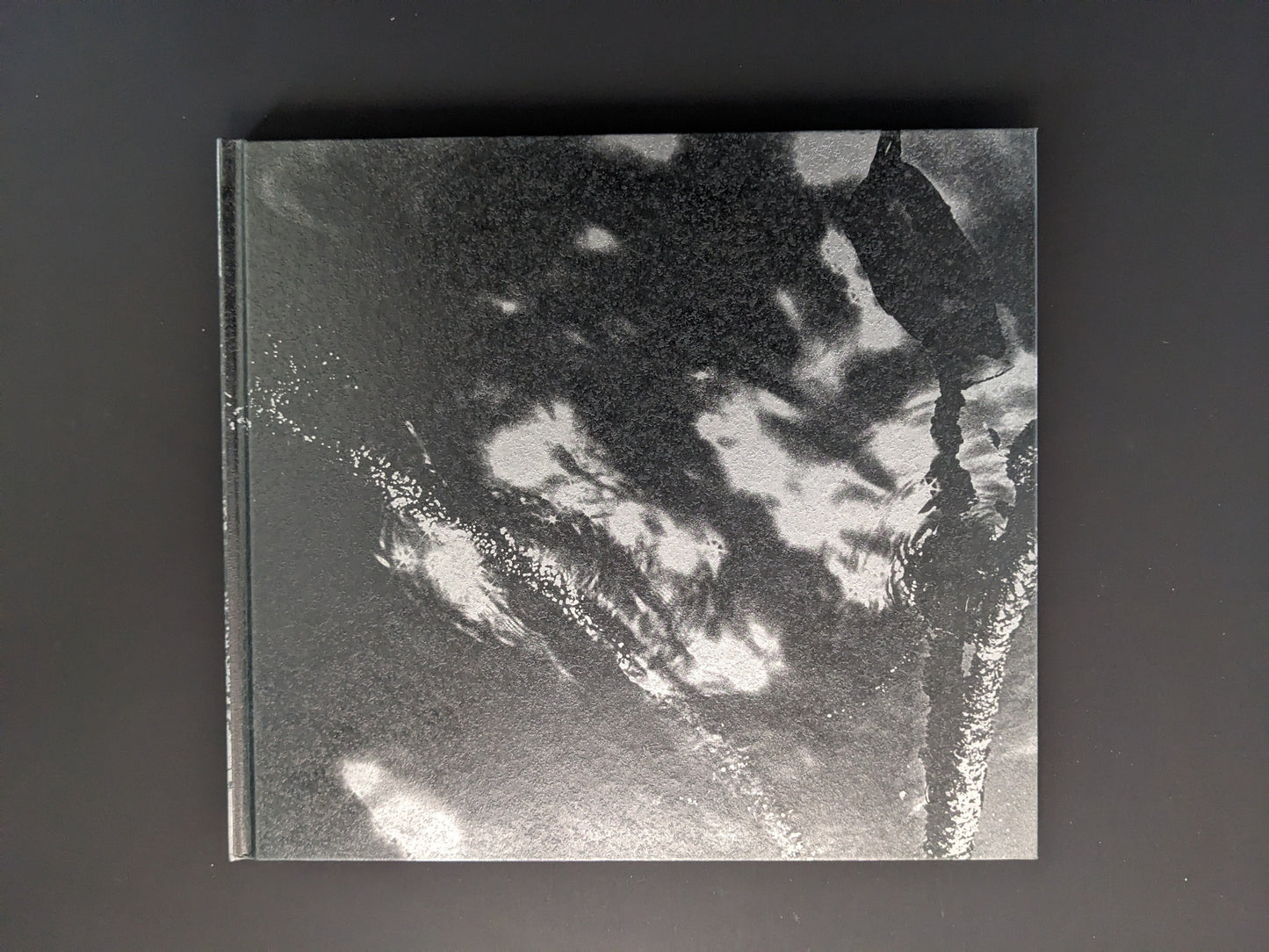 Back cover of the photobook 1980s Remnants by Daido Moriyama with abstract black and white design