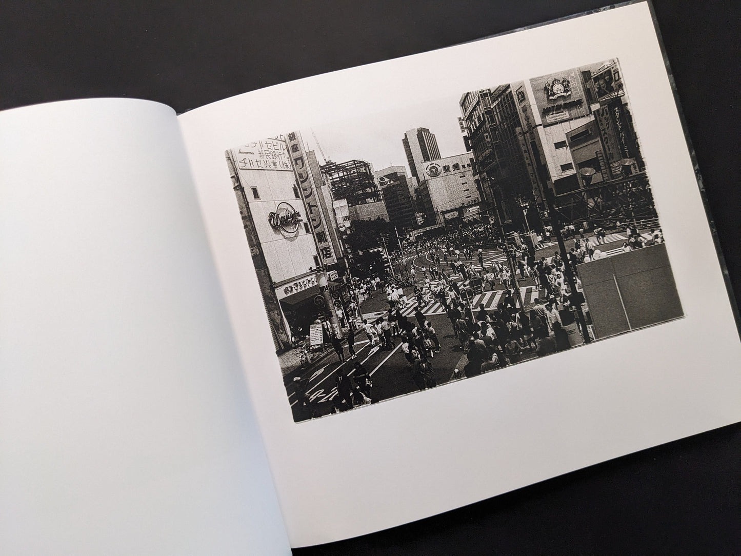 Black and white street photograph from 1980s Remnants by Daido Moriyama showing busy Tokyo intersection