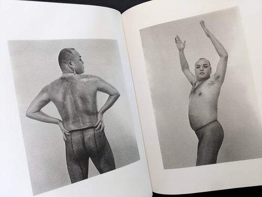 Open spread showing two black-and-white nude portraits in Eros Lost by Seiji Kurata.