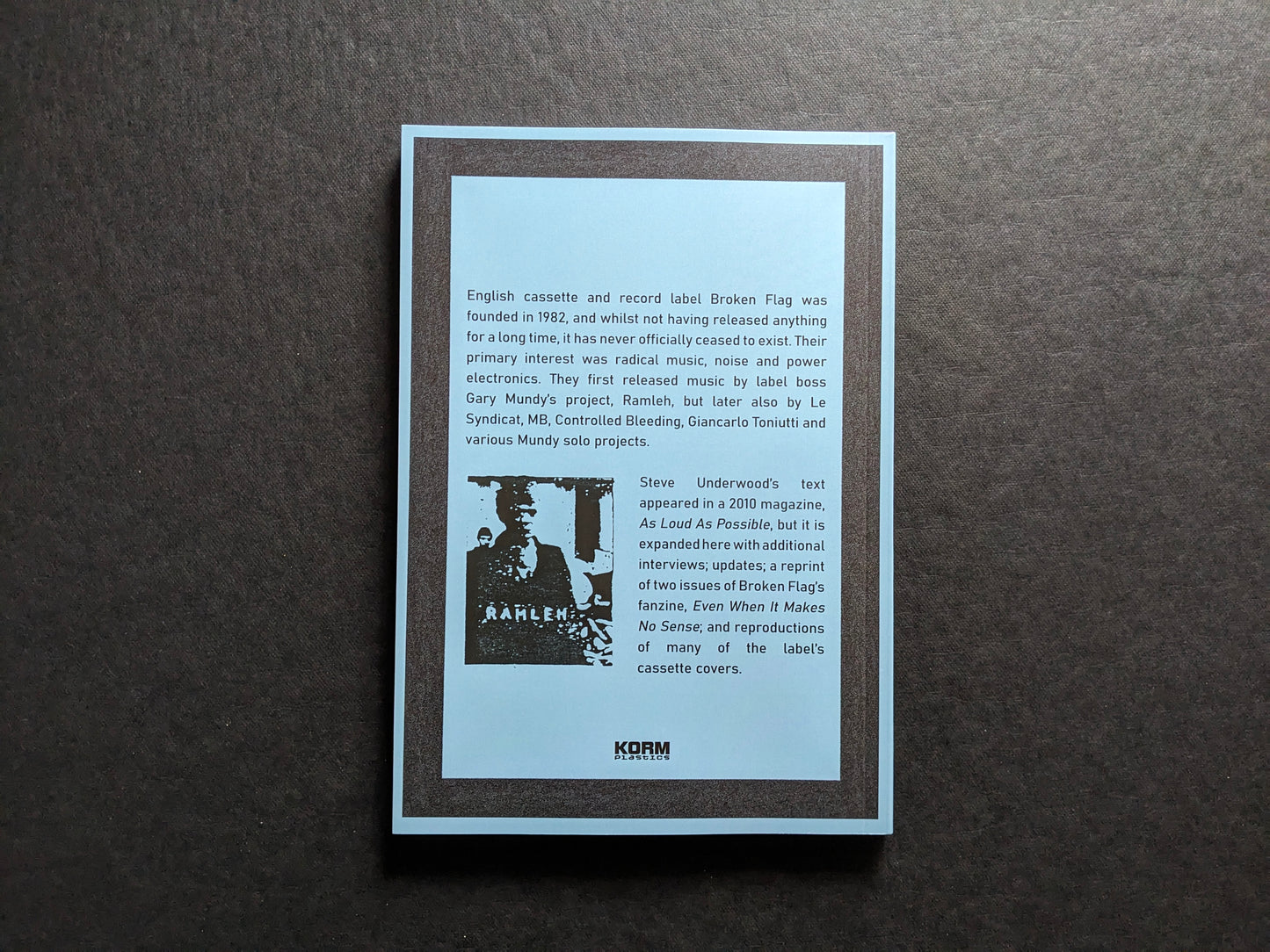 Back cover of Even When It Makes No Sense: the Broken Flag story with publication summary and Korm Plastics logo.