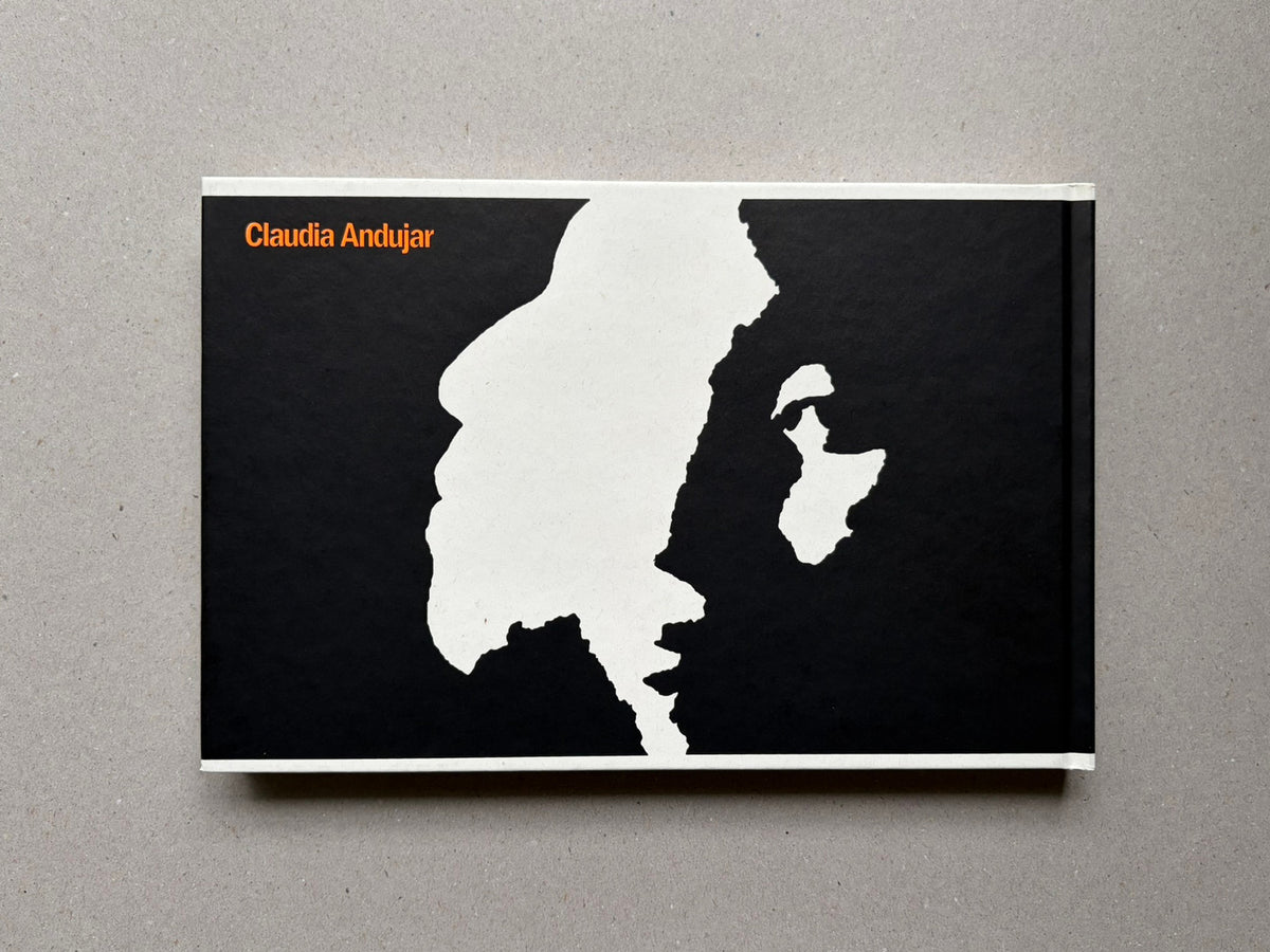 Genocídio do Yanomami by Claudia Andujar, back cover with black-and-white graphic design and orange author name