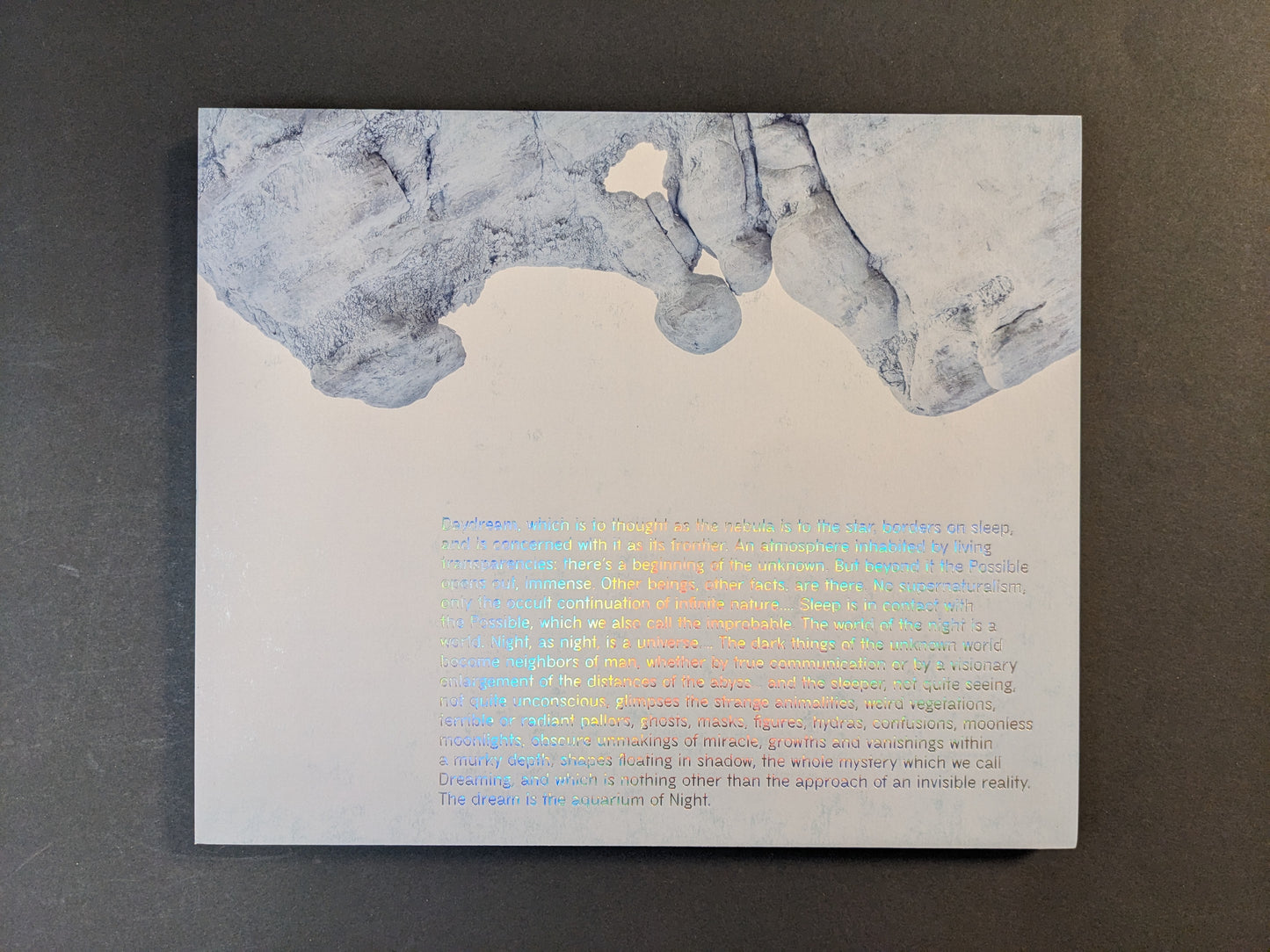 Back cover of Glass Mountain by Michael Lundgren photobook with foiled text and rock image