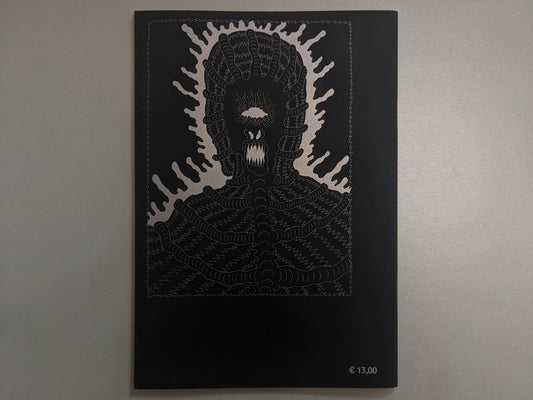 Back cover of Grayworld with a silver monster face and price mark on black paper