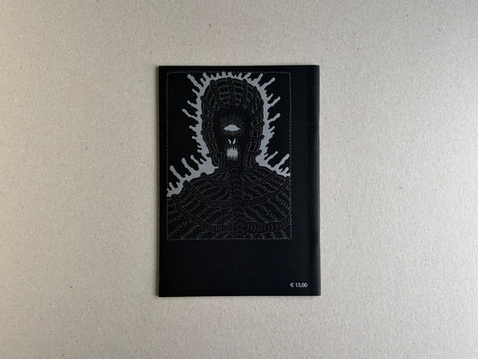 Back cover of Grayworld with a silver monster face and price mark on black paper