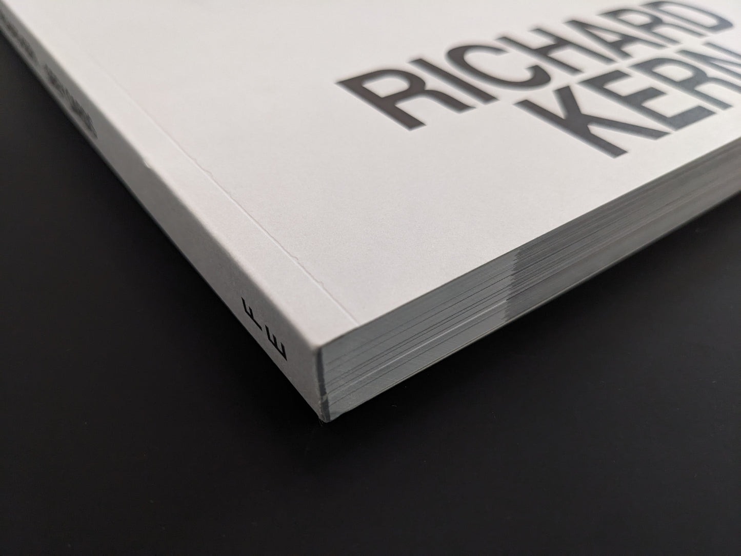 Close-up of the spine and edge of the softcover photobook "Grey Cards" by Richard Kern.