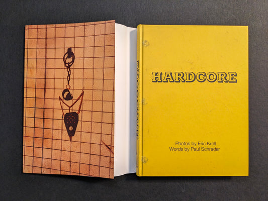 Book shown with dust jacket removed, revealing the yellow cloth cover of “HARDCORE” and the printed dust jacket.