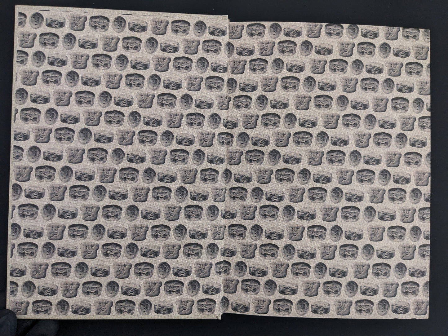 Patterned endpapers with breadling effigies – How to Bake a Breadling by Brad Hock