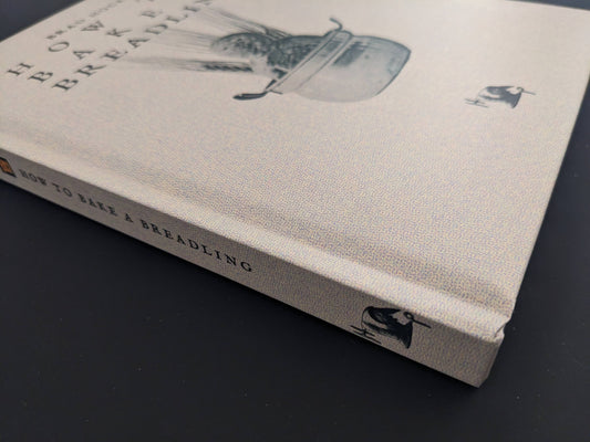 Spine of How to Bake a Breadling with title and Hollow Press logo