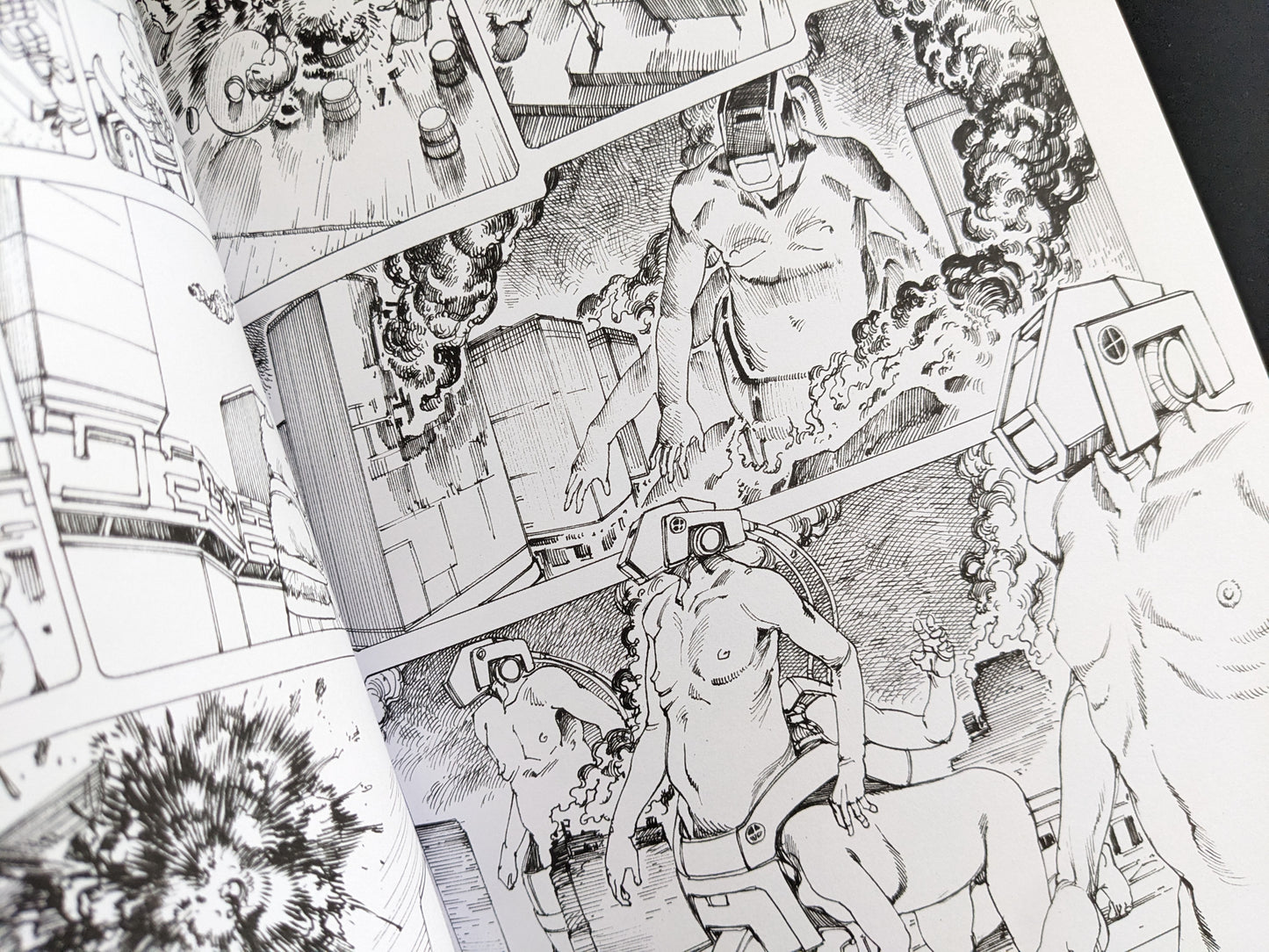 Manga page with humanoid figures in mechanical armor attacking industrial buildings