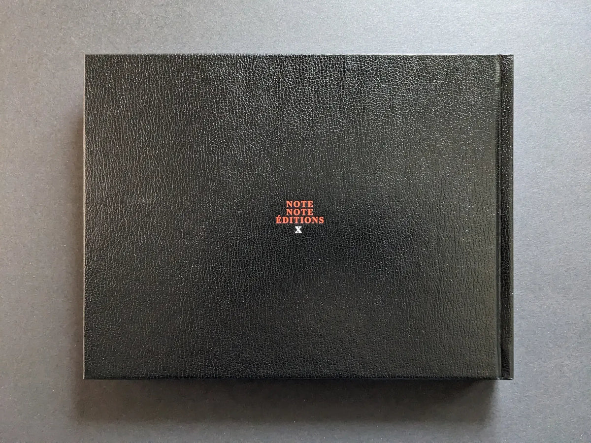 Back board of the black hardcover photobook Keep Distance, with a small Note Note Éditions logo.