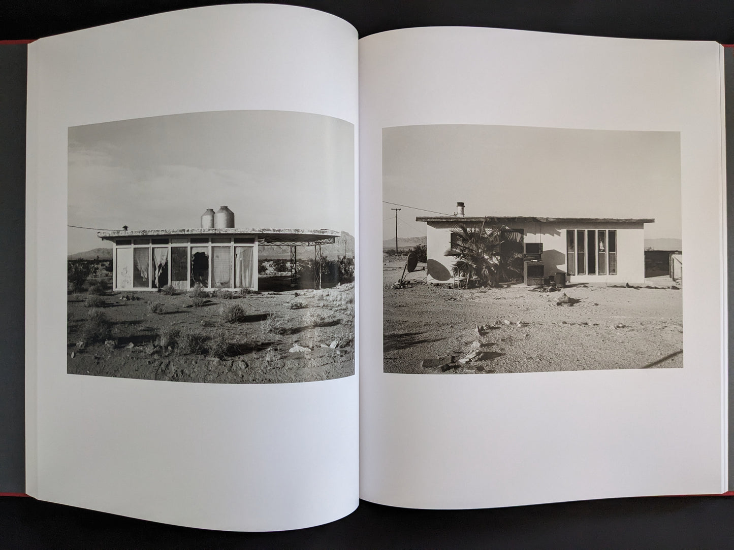 Double-page spread with two desert homes photographed by Mark Ruwedel