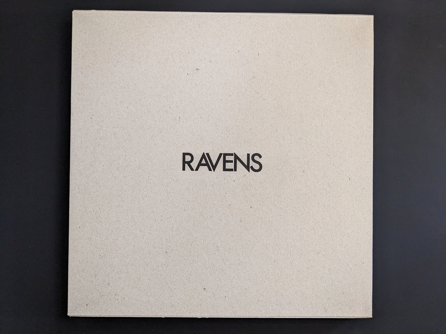Front cover of "Ravens" by Masahisa Fukase with English title on natural cardboard.