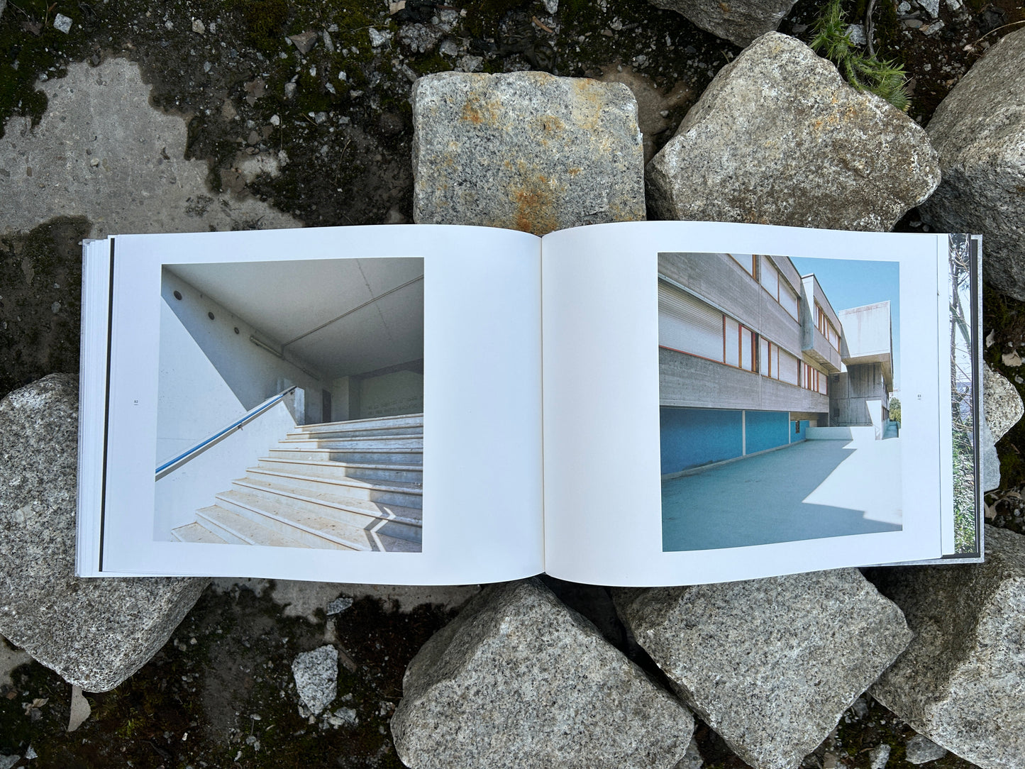 Spread of 'Alveare' by Matthias Heiderich and Andrea Belfi showing stairs and an institutional building facade.