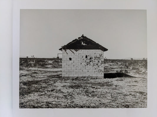 Interior photograph of a small cinder block desert structure