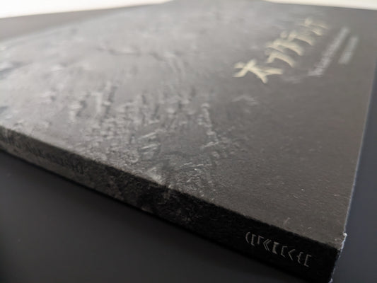 Edge view of the spine and hardcover surface