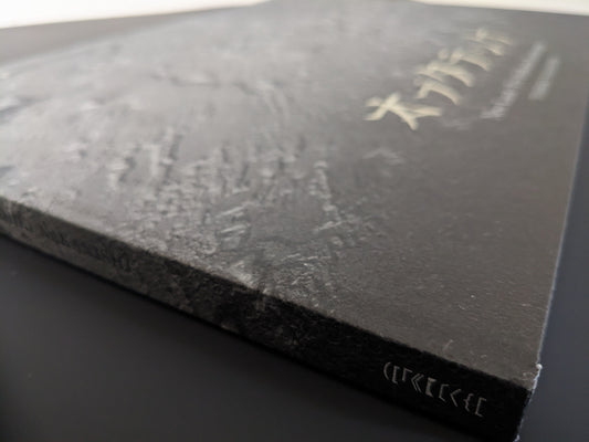 Edge view of the spine and hardcover surface