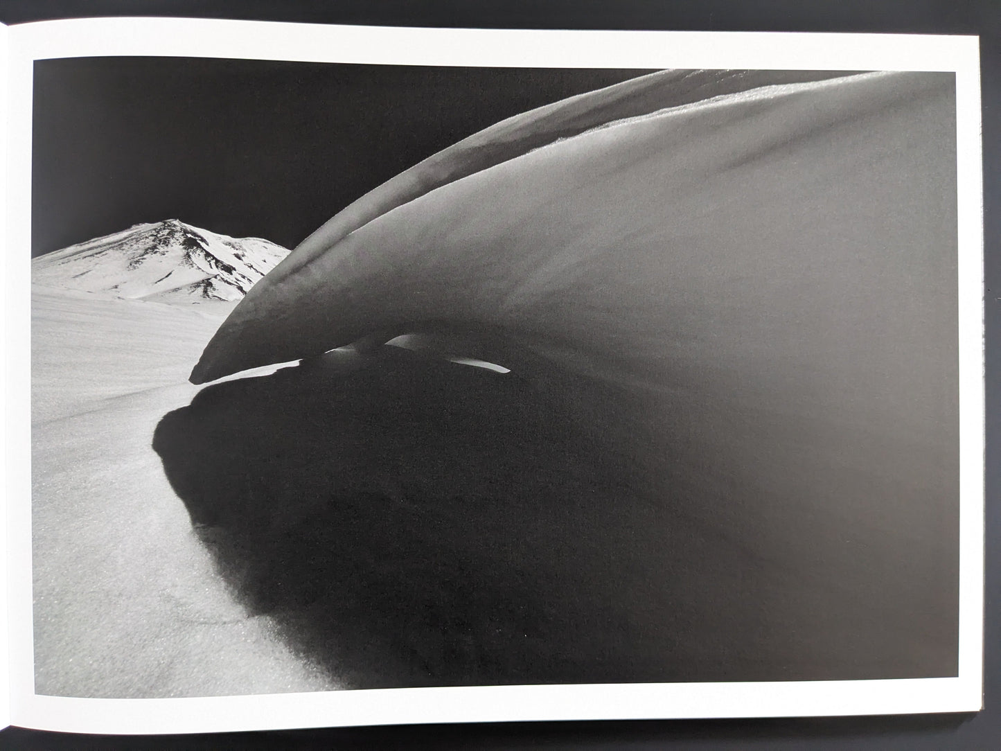 Close-up of snow wall resembling abstract sculpture – photograph by Toshiki Nakanishi