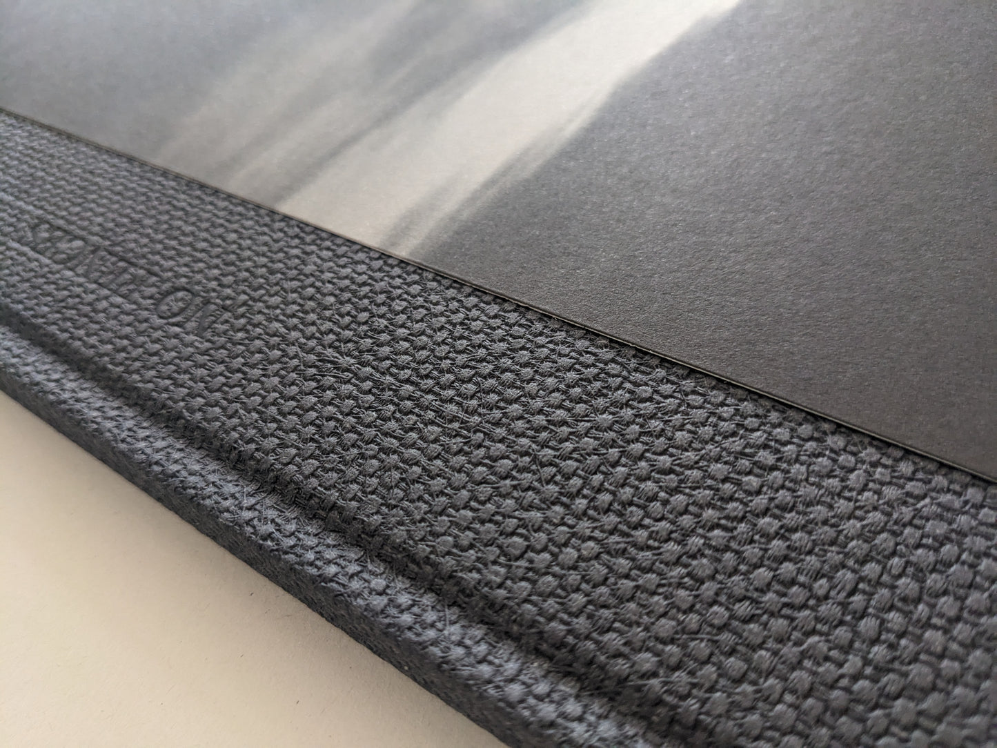 Close-up of the textured spine and interior black-and-white photograph in 'No Fences'