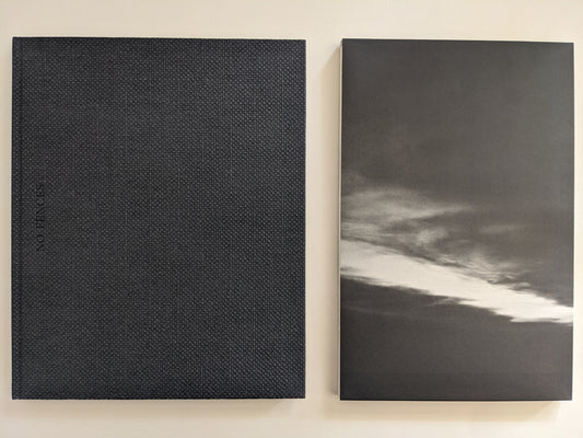 'No Fences' slipcase and book shown side by side, both in black-and-white with minimalist design