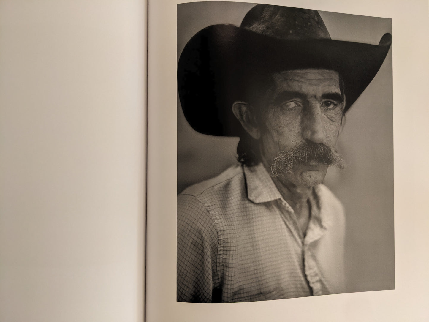 Portrait of cowboy with large hat and mustache from No Fences by Mark McLennan