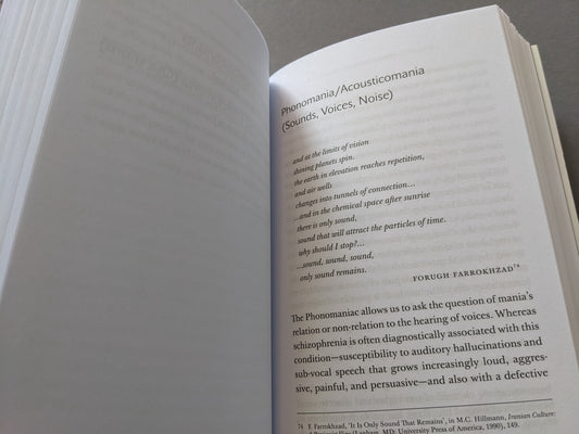 Interior spread of Omnicide II discussing phonomaniac madness and quotes from Forugh Farrokhzad.