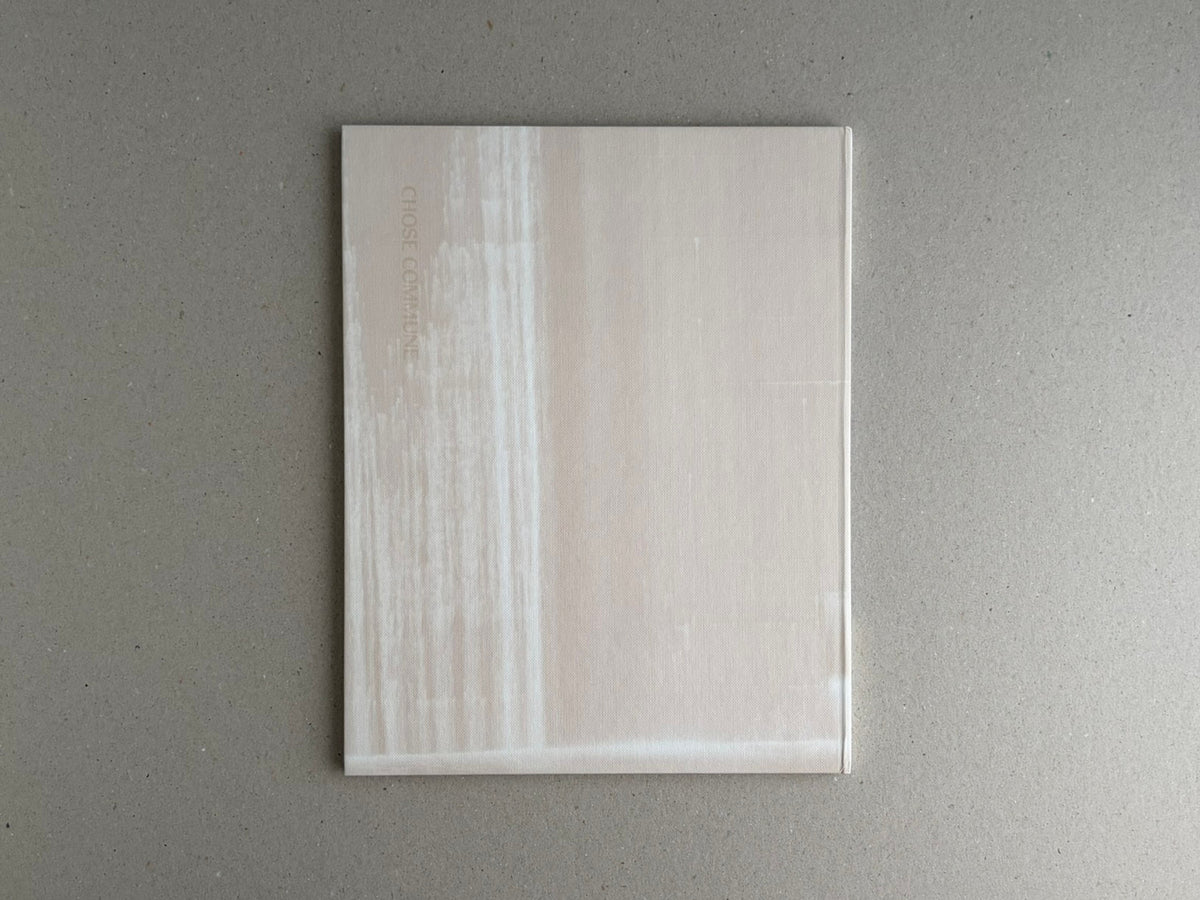 Painting – Toshio Shibata, back cover of the book in a translucent protective sleeve on a grey surface.