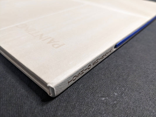 Spine detail of Painting by Toshio Shibata, with the printed title and blue ribbon visible.