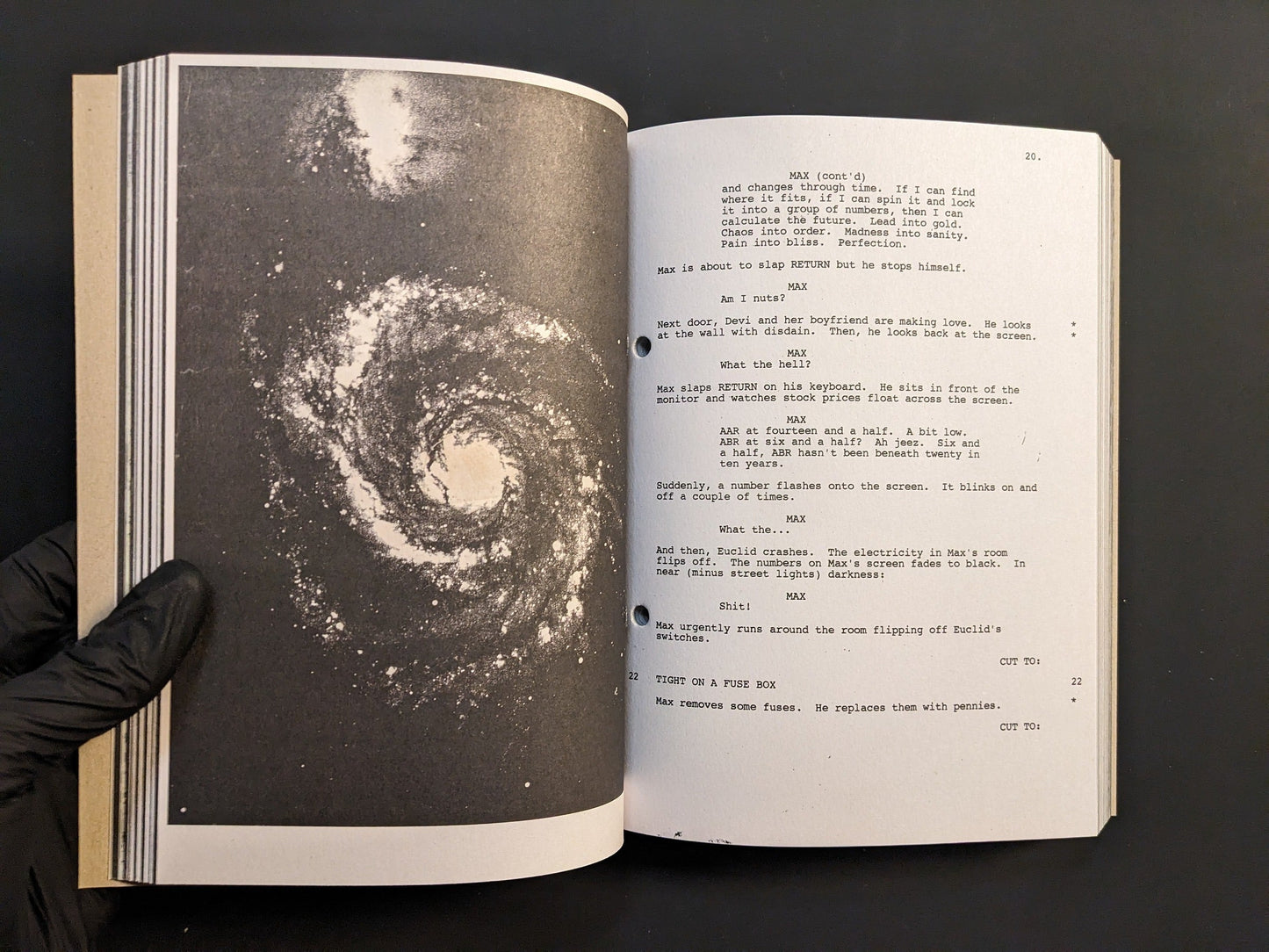 Page from Pi: The Guerilla Diaries featuring a galaxy photograph and early film script notes.