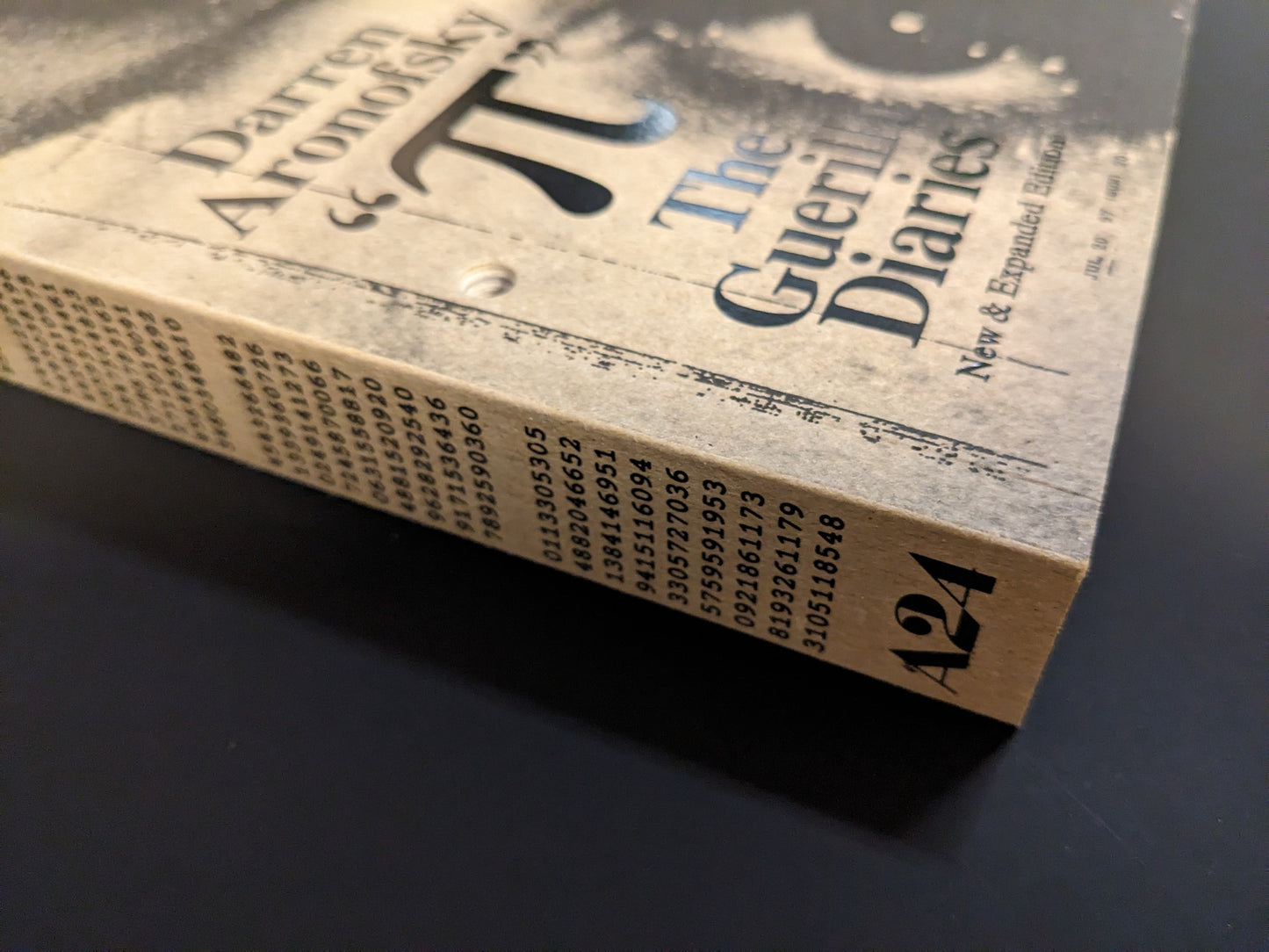 Spine of Pi: The Guerilla Diaries by Darren Aronofsky, with A24 logo and numerical design.