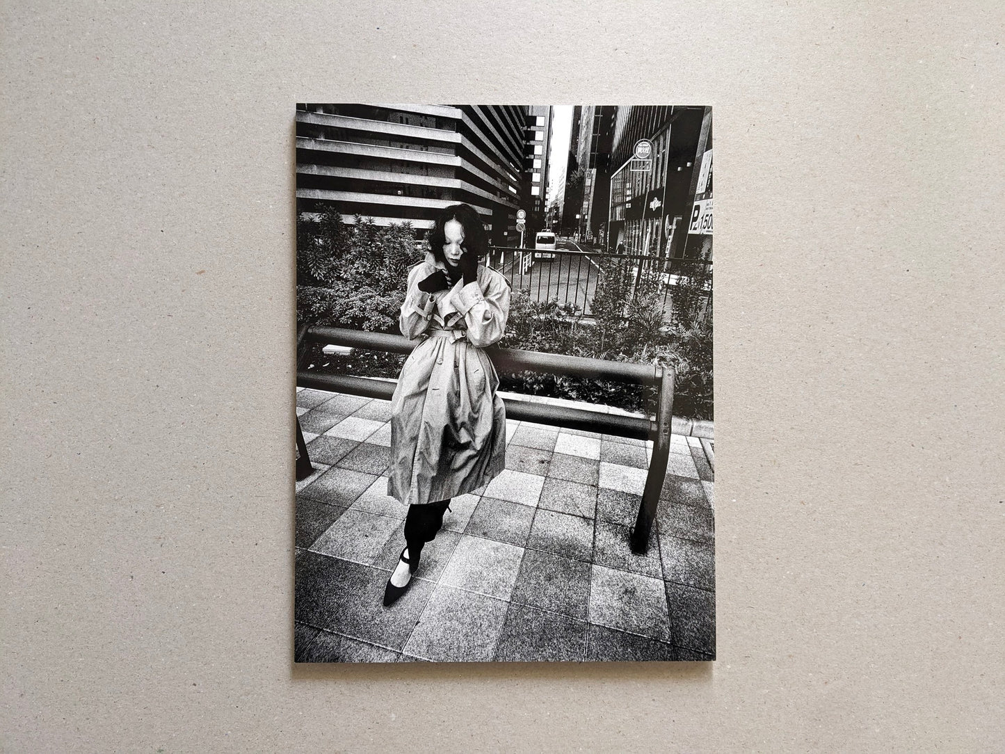 Back cover of Record No. 50 by Daido Moriyama, street photograph of a woman standing in an urban setting.