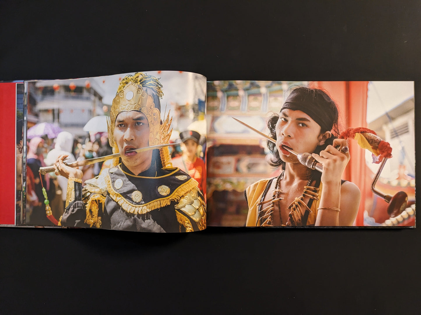 Devotees in trance with ritual piercings through their cheeks during a Southeast Asian religious festival.