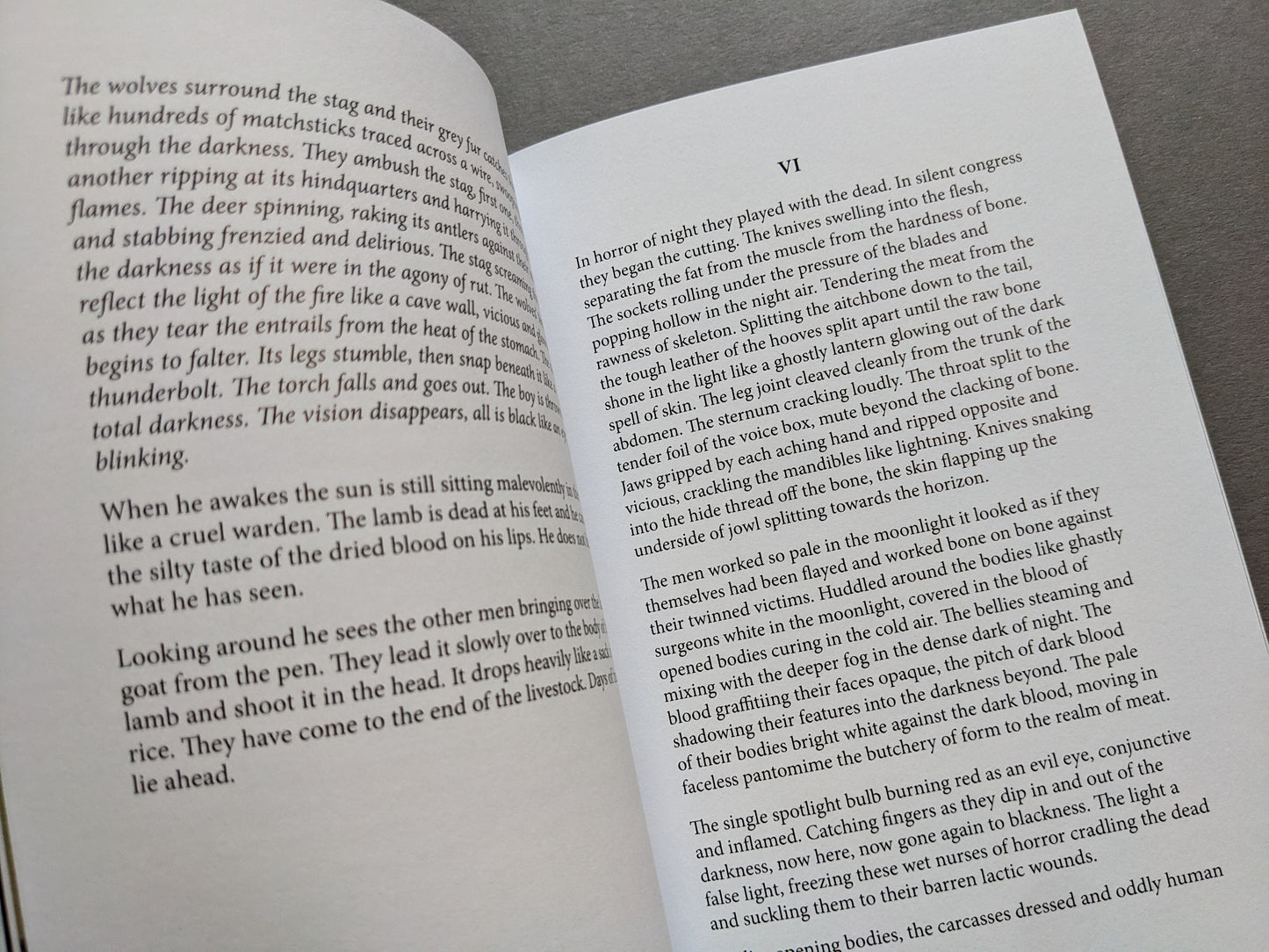 Spread from Sacra showing prose about wolves devouring a stag and a description of corpse preparation.