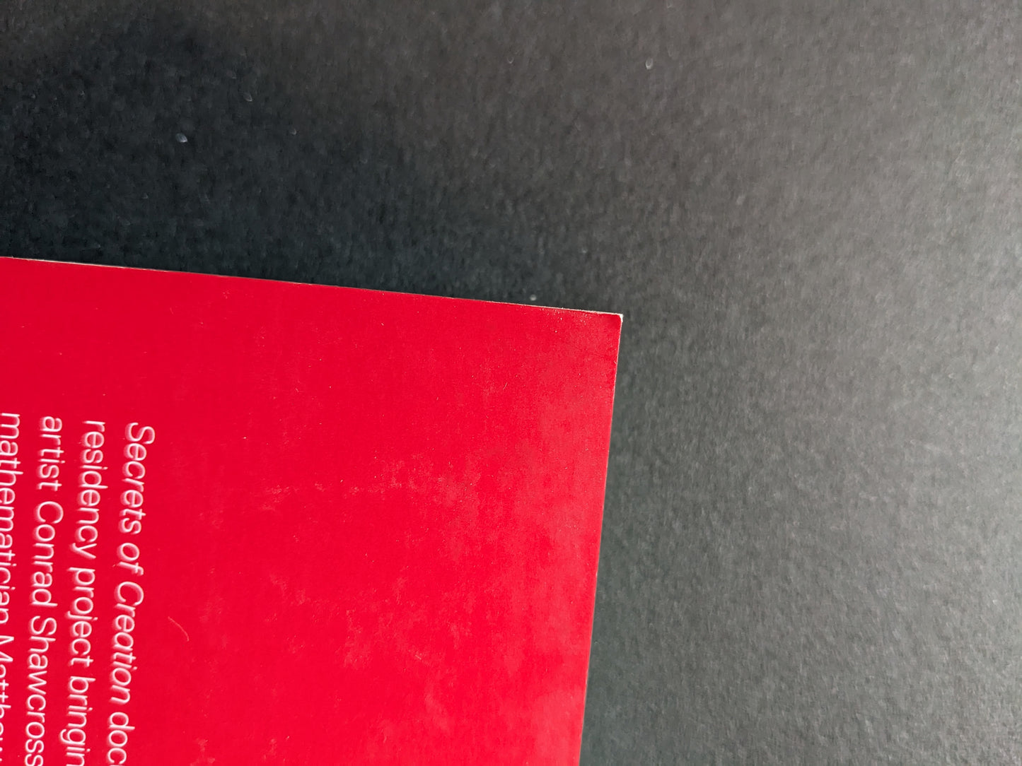 Visible corner dent on the top of back cover.