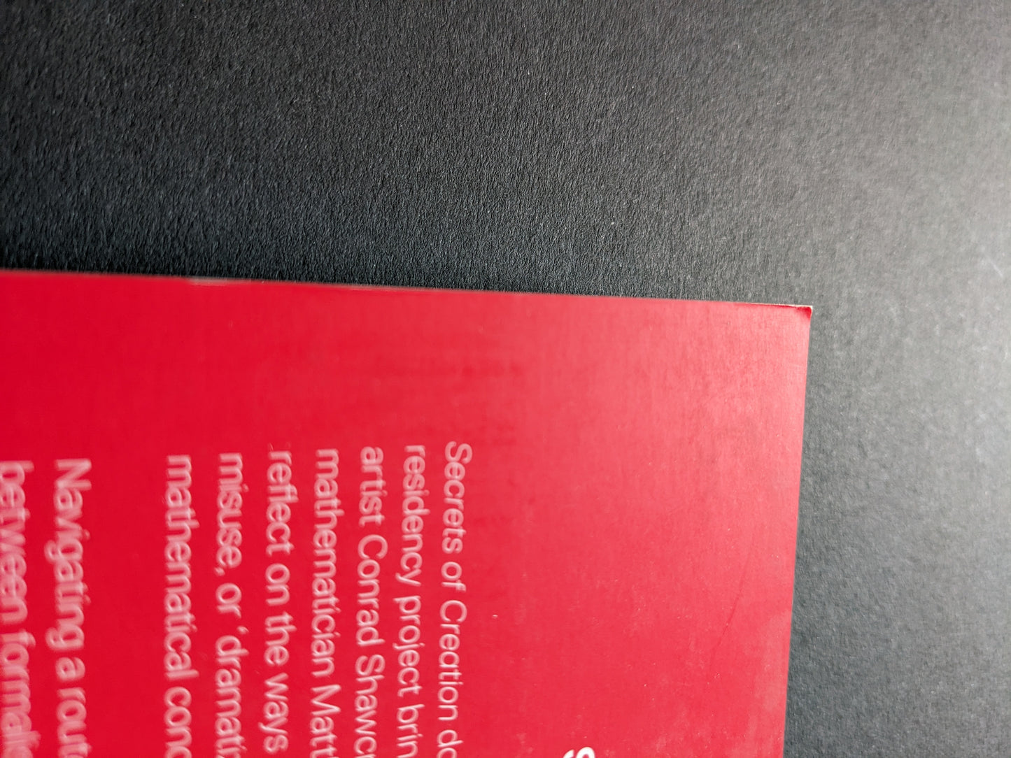 Slight fold at the top corner of the front cover.