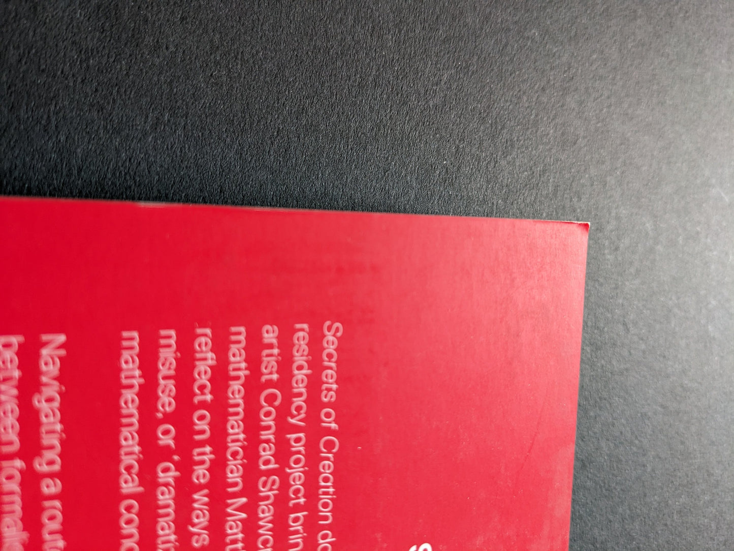 Slight fold at the top corner of the front cover.