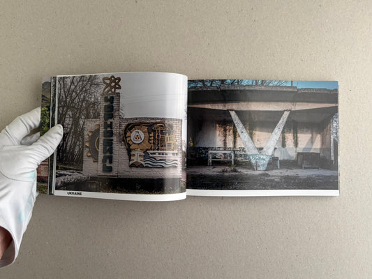 Open spread from Soviet Architectural Design by Hoshino Ai, with a decorated bus stop on the left and a concrete shelter on the right.