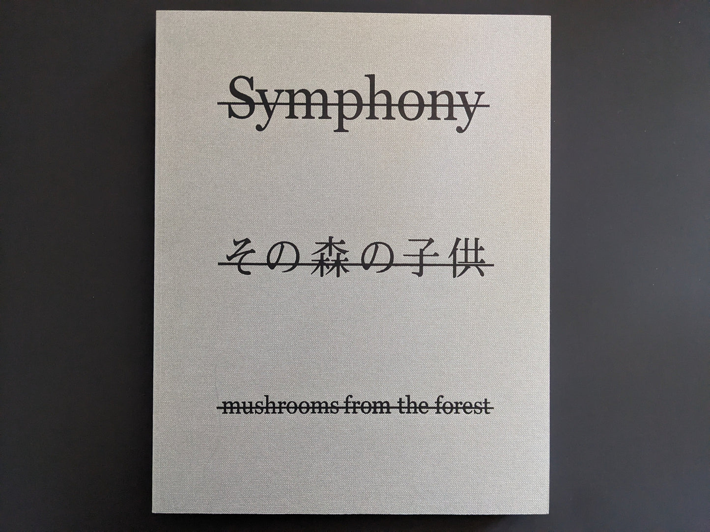 Front cover of Symphony – mushrooms from the forest by Takashi Homma with mirrored title and Japanese script