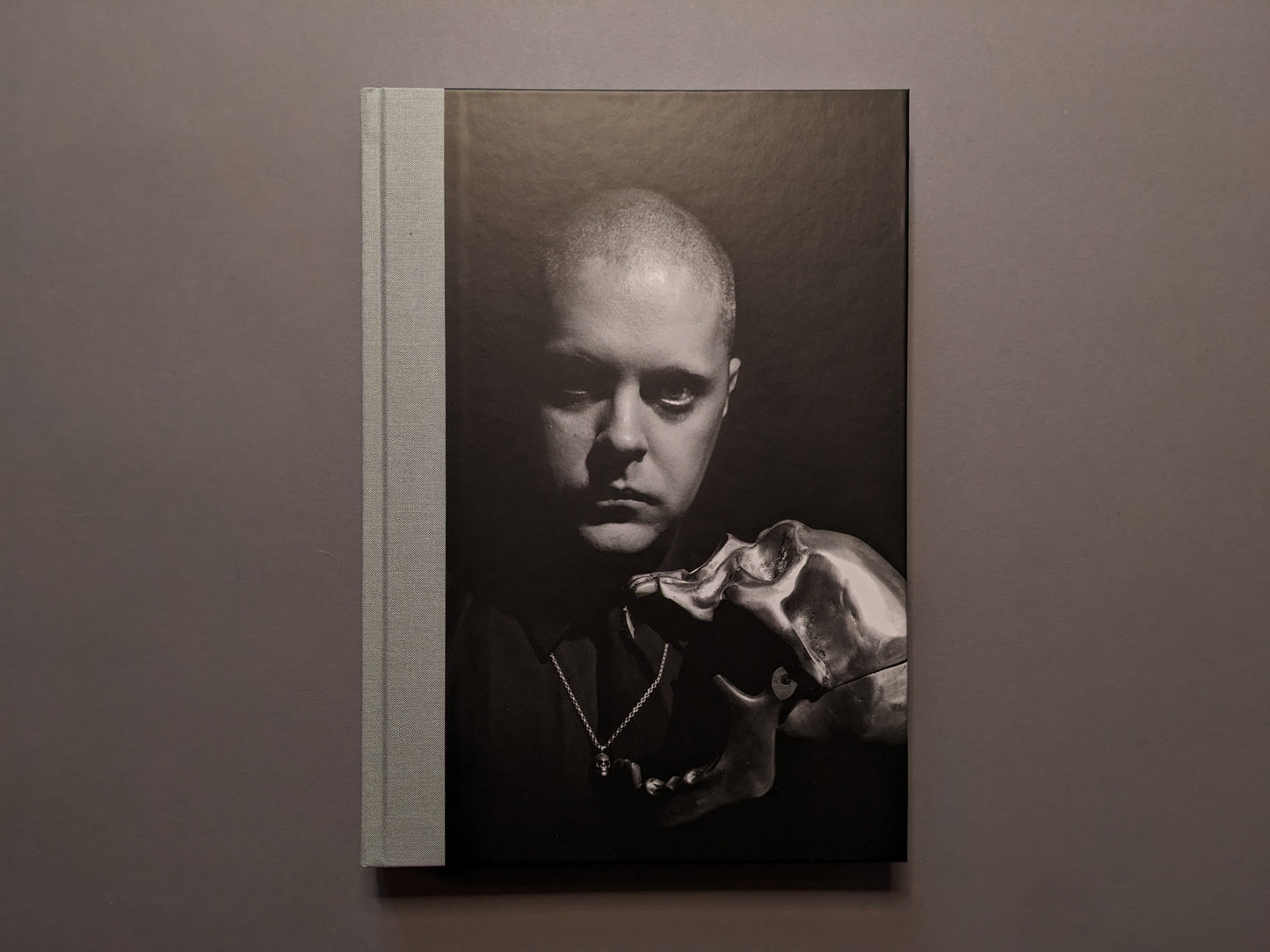 Front cover of 'The Last Slogan' by Jean Pierre Turmel – portrait of Genesis P-Orridge with a silver skull