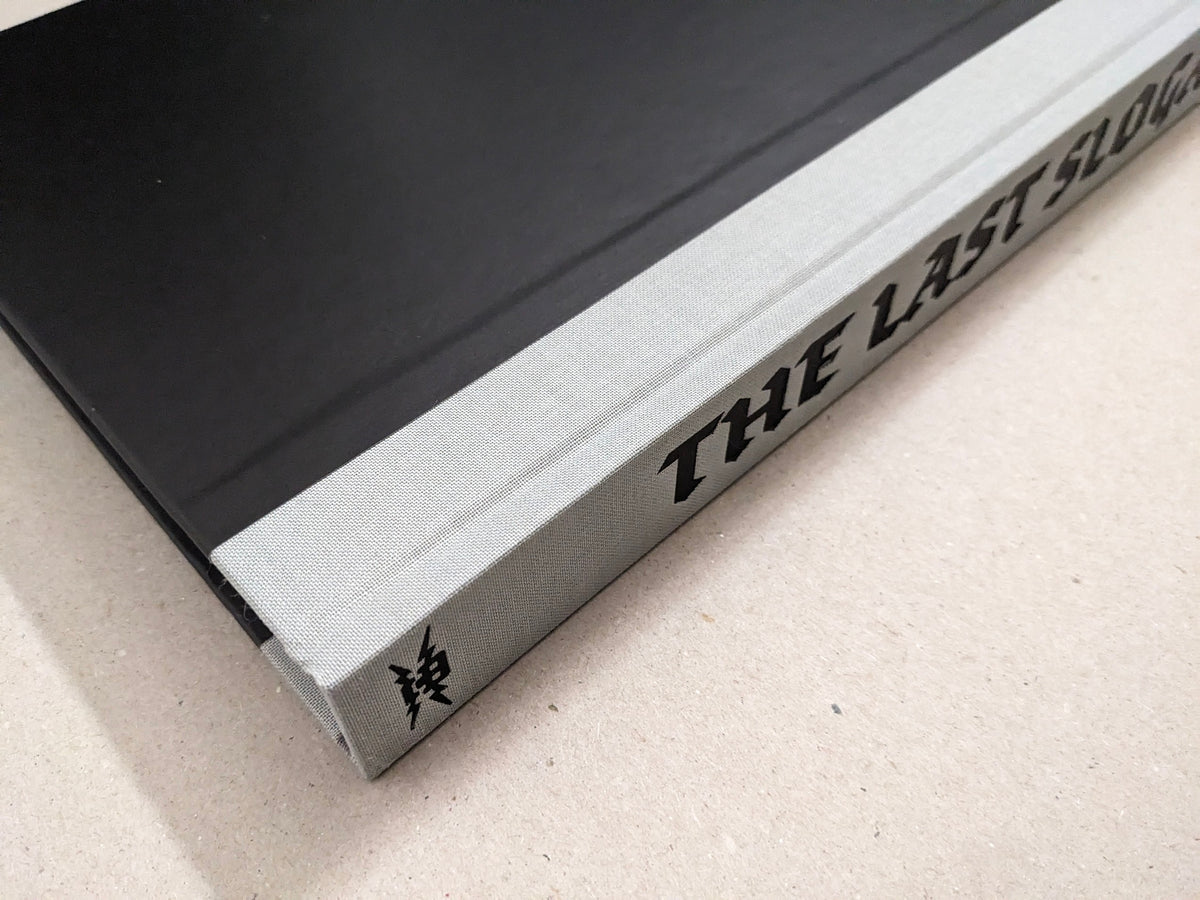 The Last Slogan Regular Edition spine with the title in gothic typeface
