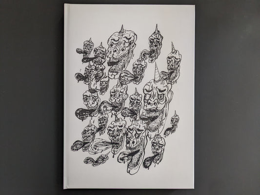 Back cover of “The Life of Namazuko” by Daisuke Ichiba, featuring a cluster of surreal horned heads in black ink on white background.